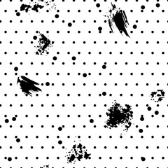 Seamless background with dots and art spots. Black and white pattern.