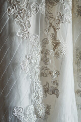 Silver laces cover wedding dress