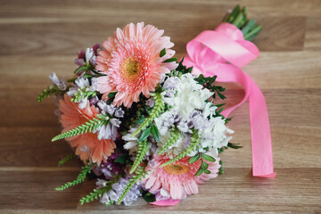 Wedding bouquet made of daisies and pink gerberas