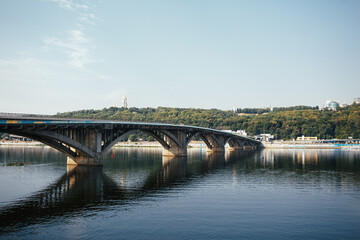 Long bridge crosses the river in Kyiv