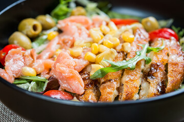 Fresh salmon salad with tomatoes