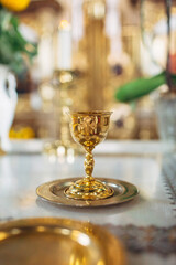 Bowl for Eucharist stands on the table in church