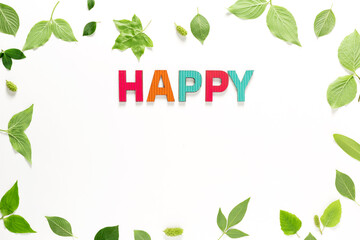 Happy text with green leaves