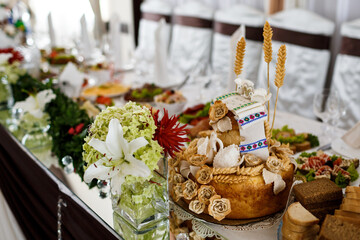 Wedding bread decorated with towel made of icing