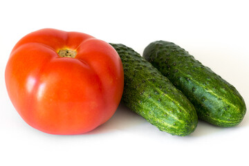 Tomato and cucumbers isolated on white background