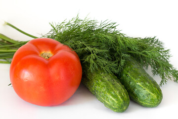 Tomato, cucumbers and dill isolated on white background