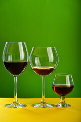 Concept of beverage degustation: alcoholic beverages in different glasses