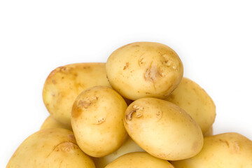 Pile of new potatoes on white background close up