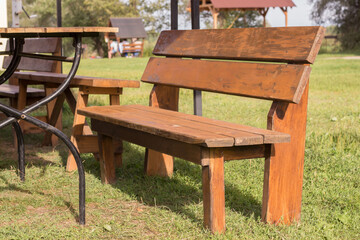 wooden bench table outside in park fragment