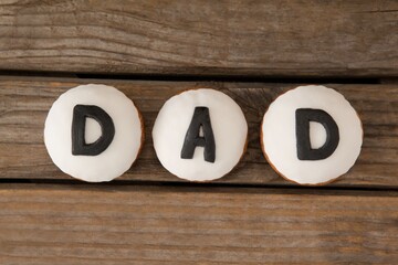 Cookies with black dad text on table