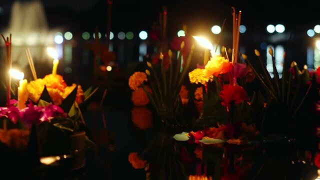 Loy Kratong Festival celebrated in Thailand. Launch boats from beautiful flowers and candles in the pond. 4k, 3840x2160