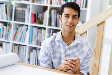 Young man architect in office