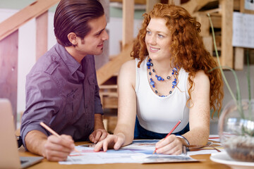 Two young architects in office