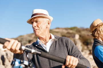 Senior man fishing with his grandson