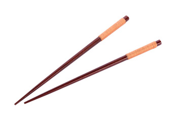 Wooden pairs of chopsticks on white background