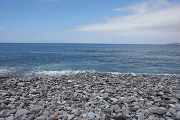 Fototapeta na wymiar on the beach close to blue sea