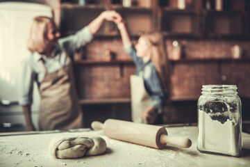Grandma and granddaughter in kitchen