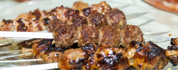Fried meat on sticks. Shish kebab food Kazakhs
