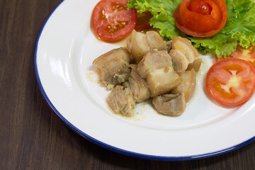 Stir fried Salted pork and vegetables in white dish chinese food / Selective focus .