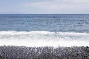 on the beach close to blue sea
