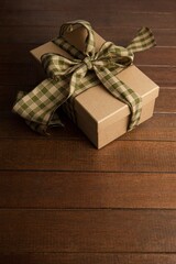 High angle view of gift box on brown table