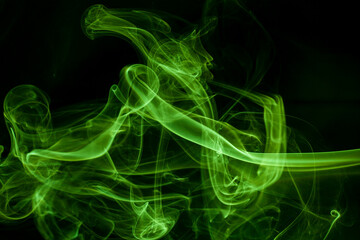 Green smoke movement on black background.