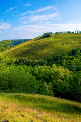 Fototapeta premium Photo of a beautiful hill and green grass