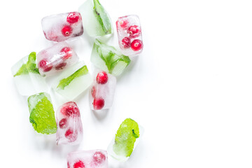 ice cubes with red berries and mint top view white background mockup