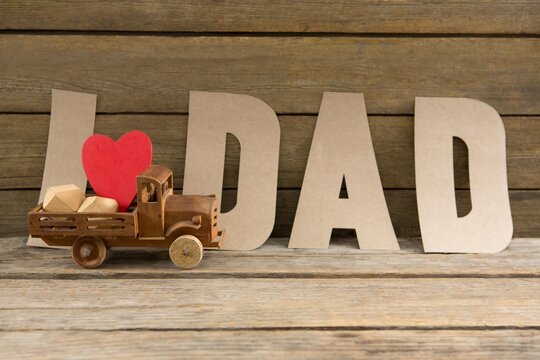 Close up of dad text by heart shape in toy truck