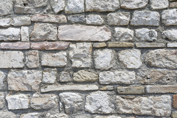 Weathered old sandstone and granite wall background