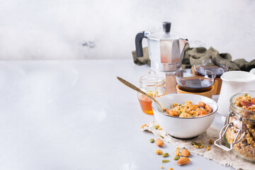 Obraz na płótnie Canvas Breakfast with black coffee muesli granola honey nuts milk
