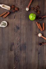 Flat lay vanilla, cinnamon, herb and spices on rustic kitchen background space for text