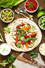 Vegetarian snack tacos with grilled vegetables and salsa.
