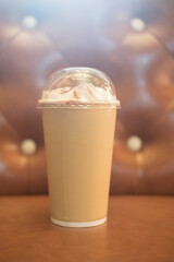 Ice coffee in paper cup with straw