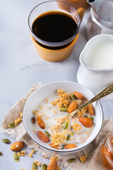 Breakfast with black coffee muesli granola honey nuts milk