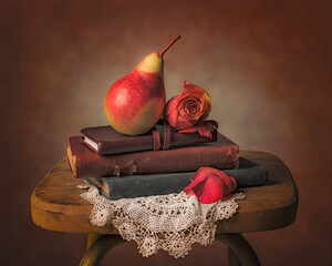 Book and pear still life