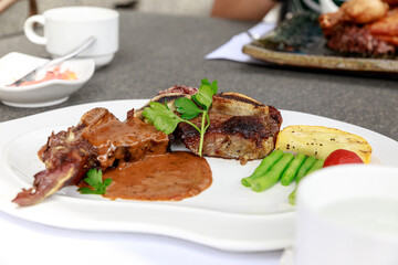 BBQ Steak. Barbecue Grilled Beef Steak Meat with Vegetables