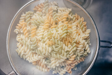 .Cooked macaroni without sauce ready to season and gratin. Lifestyle photography