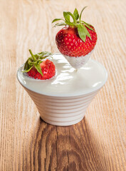 bowl with sour cream and strawberries