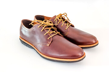 Men's classic brown leather shoes isolated on white background, Top view with copy space and text.