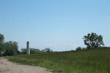 Fototapeta na wymiar lighthouse in field