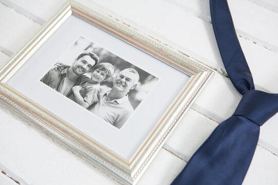 High angle view of photo frame with necktie