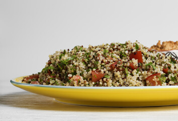 Quinoa tabbouleh with hummus and pita triangles
