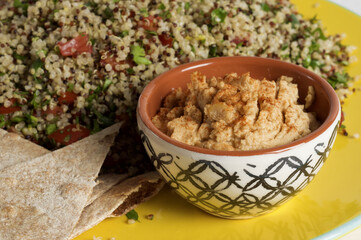 Quinoa tabbouleh with hummus and pita triangles