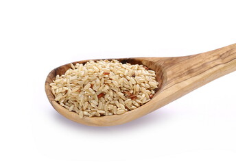 Integral, brown rice and wooden spoon isolated on white background