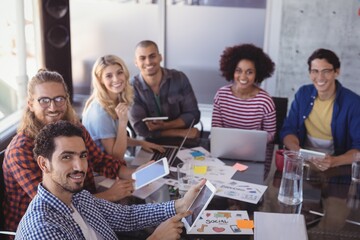 Portrait of business team working together at desk