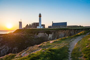 Fototapeta na wymiar Abbey ruin and lighthouse, Pointe de Saint-Mathieu, Brittany, France