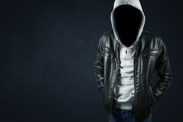 faceless hacker in dark background