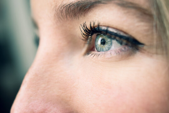 Close-up shot of blue eye of young woman