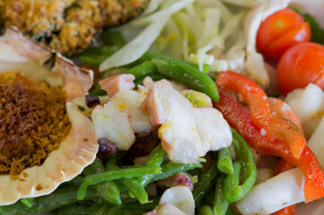 Sushi sea food in the restaurant close up. King prawns, seaweed and caviar for gourmets.